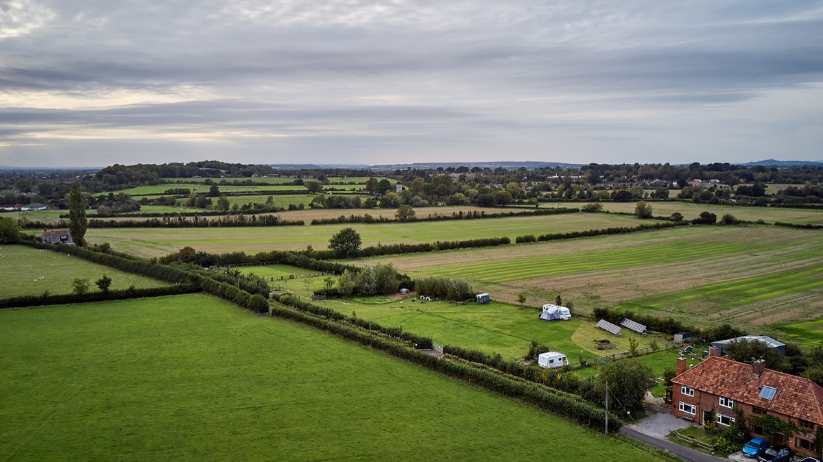 Aerial view of Meadow Cottage CL and surrounding Somerset countryside
